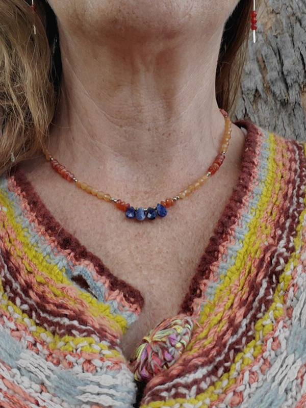 earthy sweater with orange & blue gemstone necklace